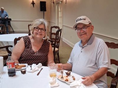 Cathy Taylor and Jerry Stanley having their dinner and enjoying the live music