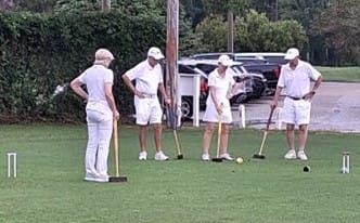 Beth, Glenn, Brigitte and Dean resume play after a slight rain delay.