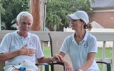 Glenn and Brigitte killing time during the rain delay.