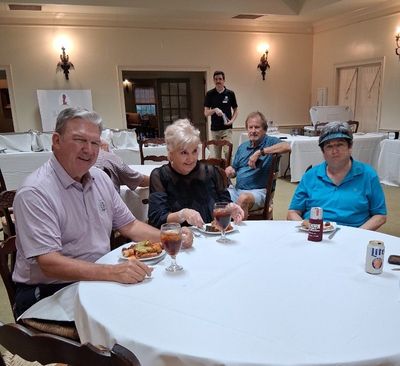 Len and Nancy Sparks with Robin Flewellen enjoying their meal after the tournament