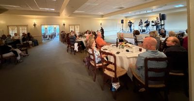 Crowd enjoying the performance and dinner