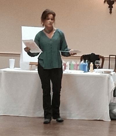 Christie Chandler instructs the artists.