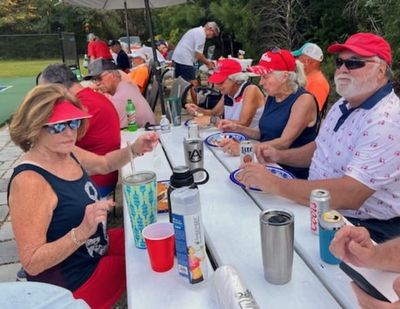 Dining on grilled burgers and hotdogs was a key part of the event.