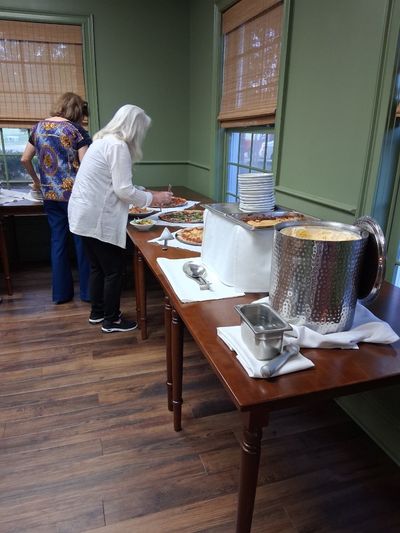 Pizza bar, salads, and peach cobbler with ice cream prepared by Chef Dave and his staff