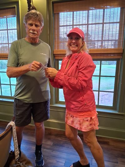 Court Sports President William Treichel and the women's winner Melanie Little